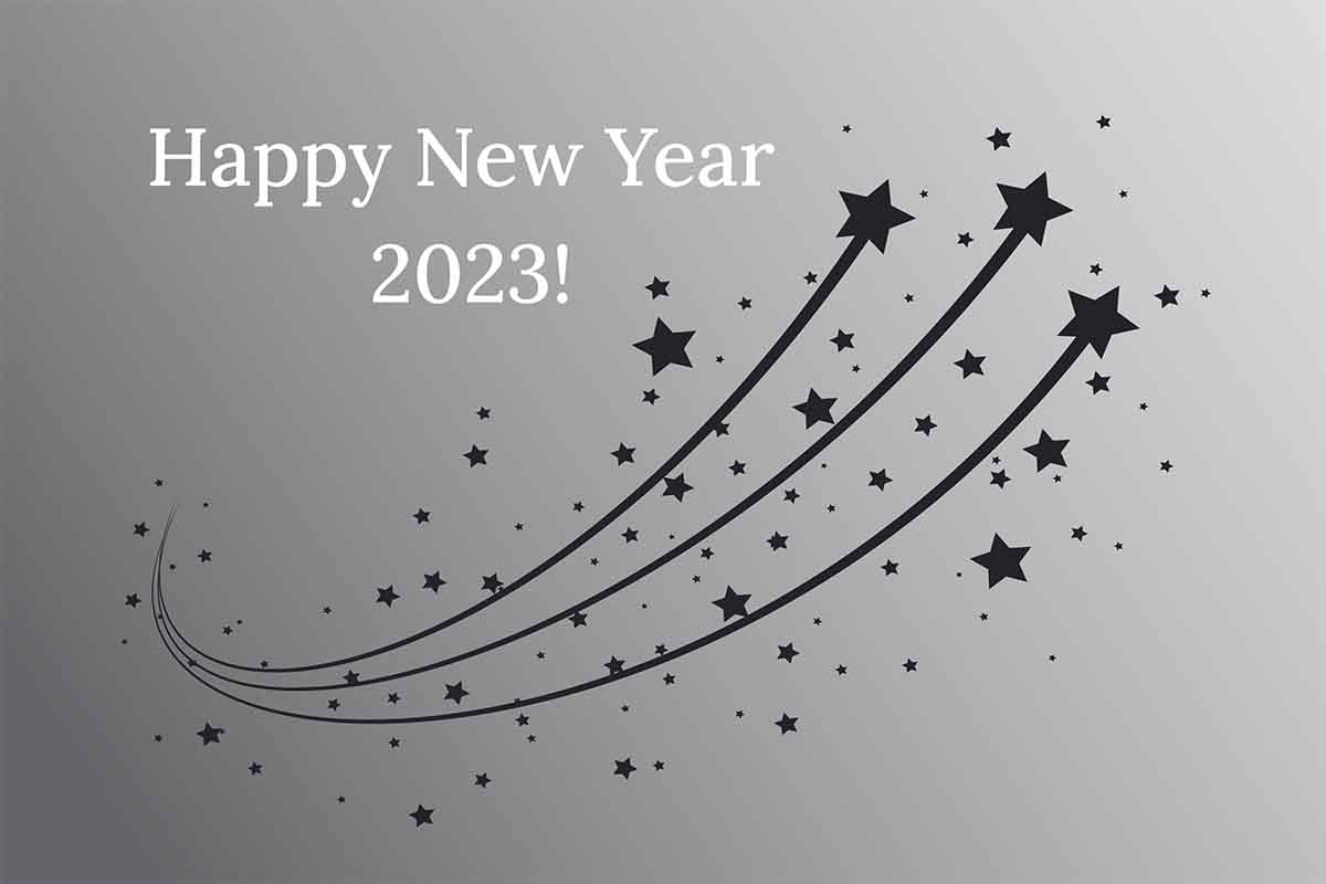 front of holiday card saying Happy New Year 2023 with shooting starts going up